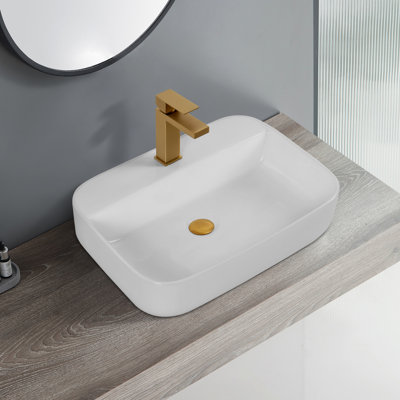 Lavabo de comptoir de salle de bain en céramique - blanc, avec une surface lisse et brillante blanchie convenant à diverses configurations