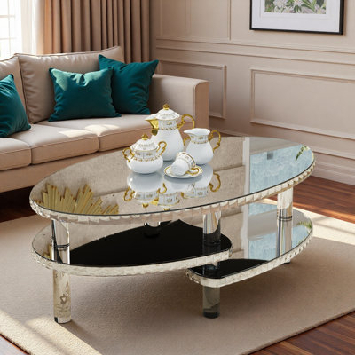 Table basse ovale en verre argenté à miroir avec conception à double couche, pieds en acrylique et décor en cristal