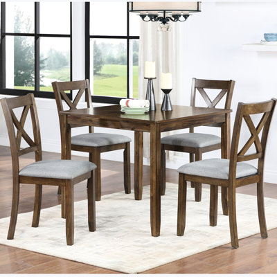 Ensemble de table et chaises de salle à manger modernes en noyer massif (5 pièces), plateau lisse, matériaux de qualité, chaises élégantes et rembourrées, table carrée, pieds antidérapants, idéal pour les pièces contemporaines.