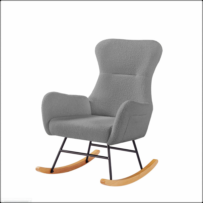 Luxueuse chaise berçante en tissu gris, douce et confortable pour une utilisation relaxante et durable.