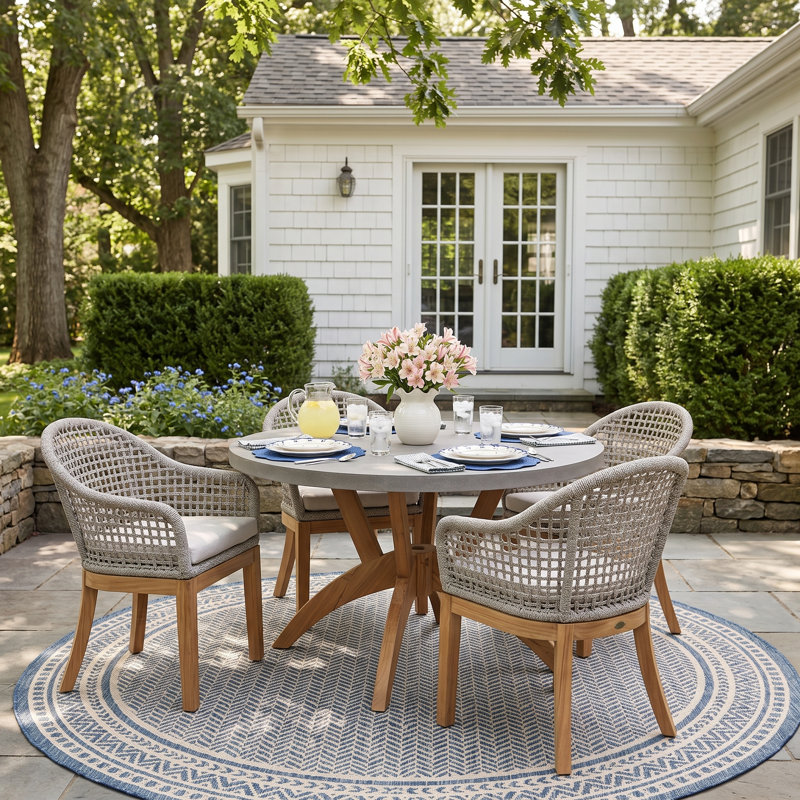 Akiva 4 - Person Teak Wood Patio Dining Set with Round Table , Sunbrella® Cushions Included