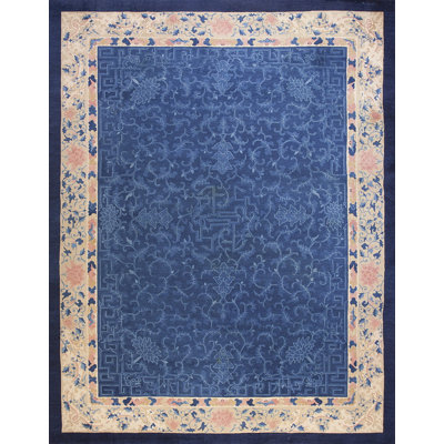 Tapis ivoire antique en laine bleu