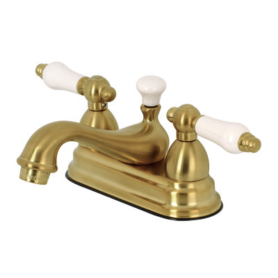 Kingston Brass Restoration Two-Handle 3-Hole Deck Mount 4" Centerset Bathroom Faucet with Brass Pop-Up