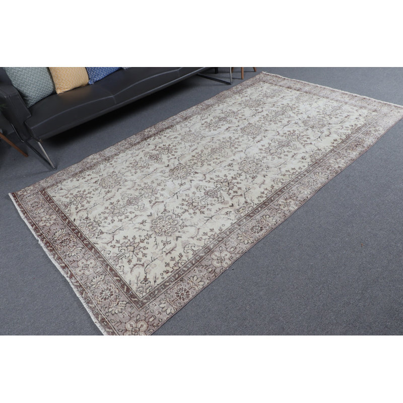 Classic Turkish Area Rug in Elegant Cream and Brown Creating An Atmosphere of Timeless Home Elegance with Unique Handmade Design and Oriental Pattern
