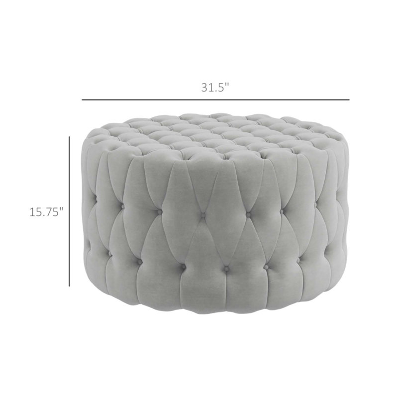 Repose-pieds capitonné à boutons avec revêtement en velours, parfait pour une utilisation polyvalente et confortable dans n'importe quelle pièce.