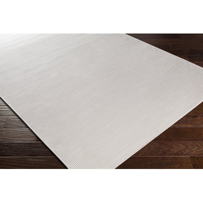 Revell Solid Color Polypropylene Indoor/Outdoor Area Rug in Cream