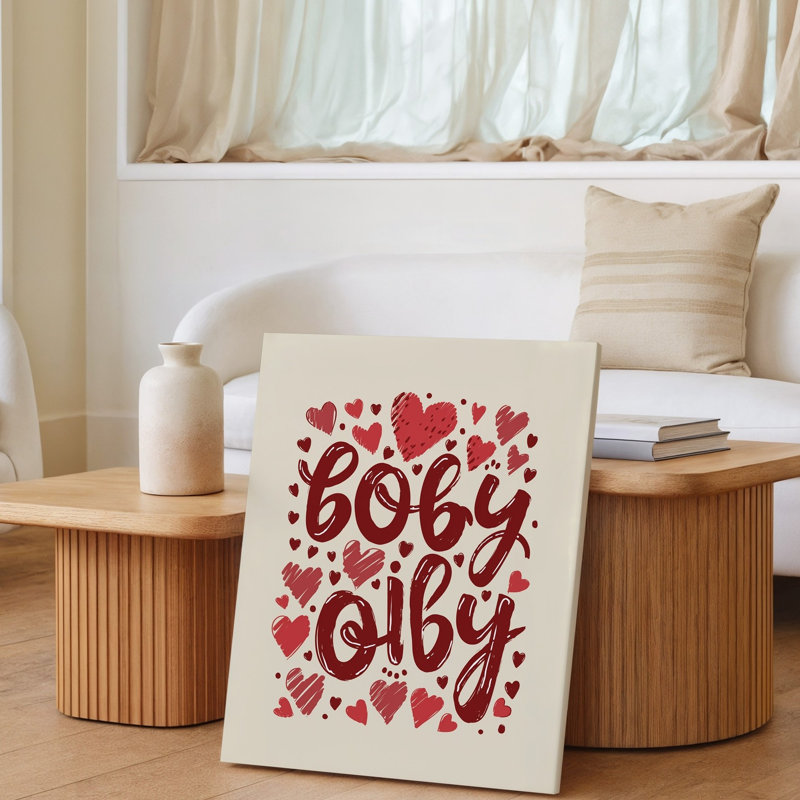 La toile crée une illustration fantaisiste avec un fond beige avec un art mural, arrangement ludique de cœurs rouges stylisés et art mural sur toile