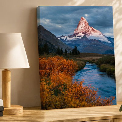 Canvas A Breathtaking Alpine Landscape Featuring A Majestic Snow Capped Mountain Wall Art Peak Rising Dramatically Against A Moody Sky Canvas Wall Art