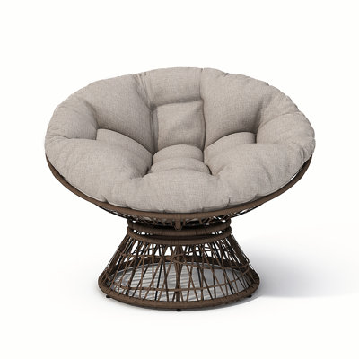 Fauteuil ergonomique en osier avec coussins en tissu épais