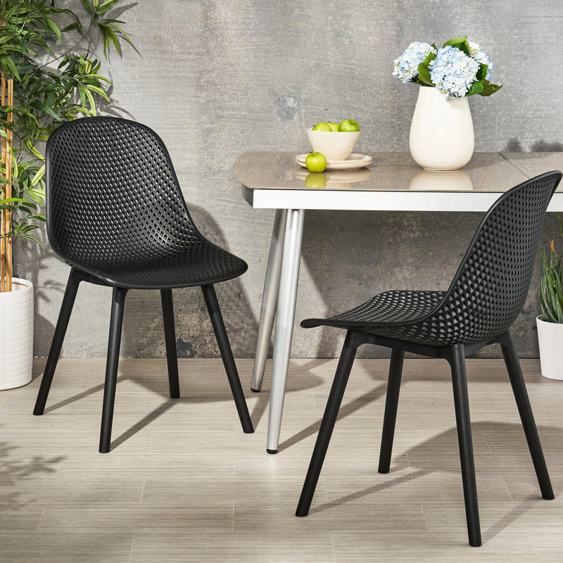 Mobilier d'extérieur Posey Chair - Polypropylène noir, structure en maille losange pour un confort élégant. Fauteuil de jardin relaxant Posey résistant aux intempéries.