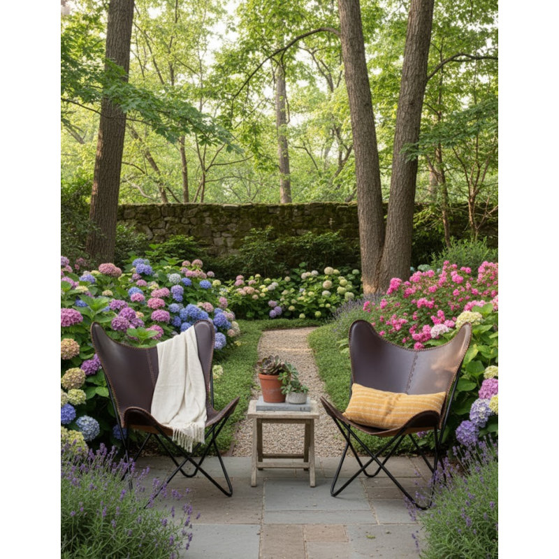 Fauteuil papillon en cuir brun foncé