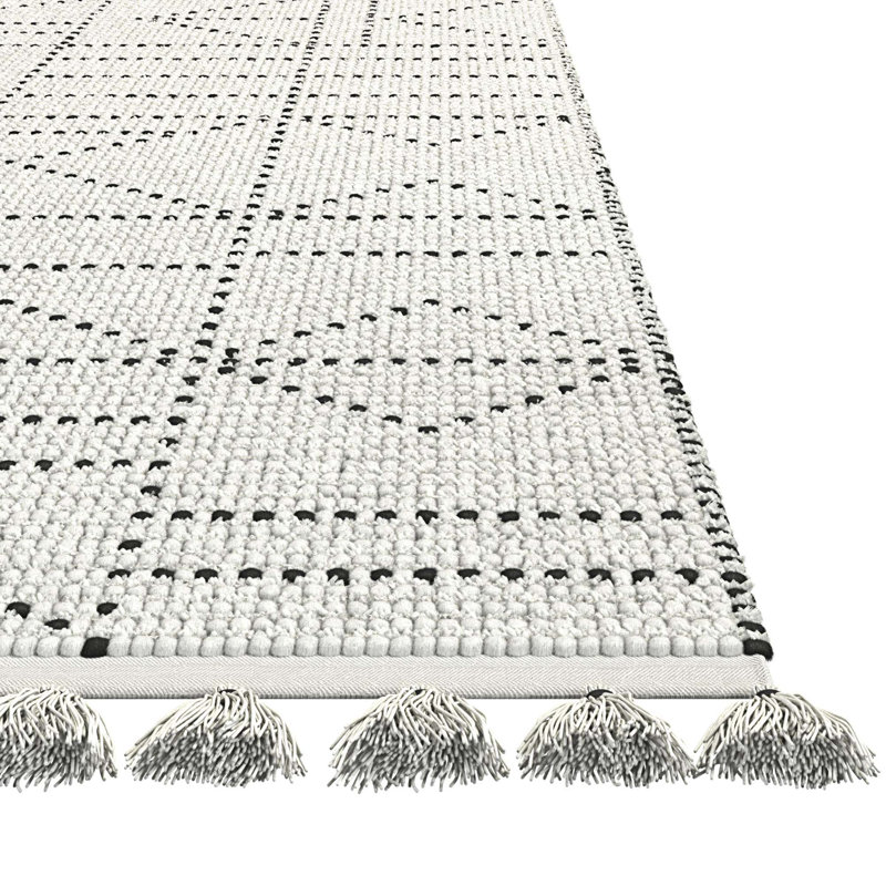 Tapis en laine et coton à pampilles
