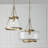 14.5" W x 20.25" H 1-Light Cone Pendant in Aged Brass with Organic Hammered Glass
