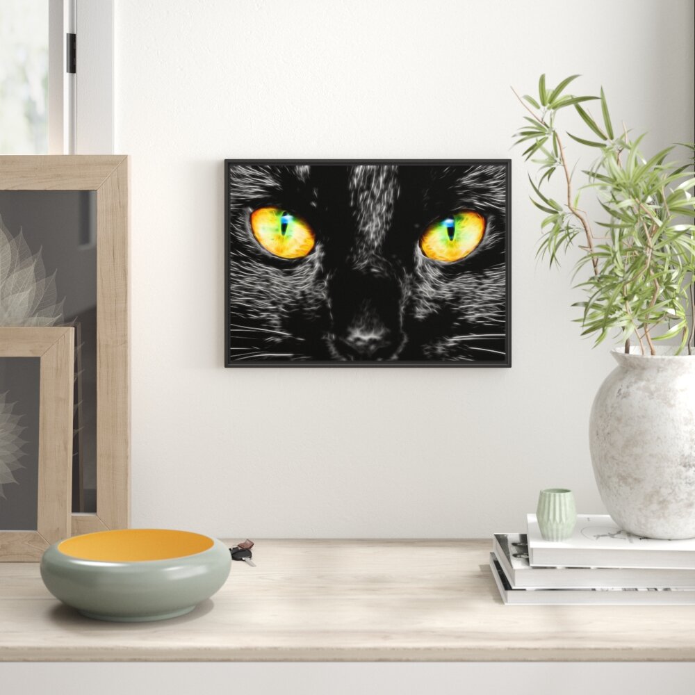 Gerahmtes Wandbild schwarze Katze mit magischen Augen