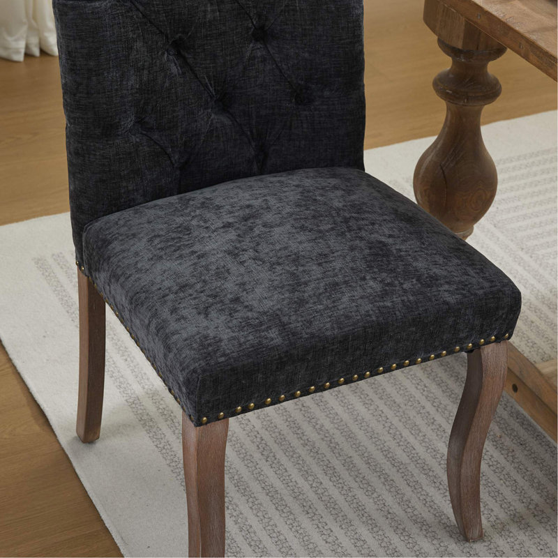 Élégante chaise de salle à manger capitonnée avec pieds incurvés en bois massif, Noir