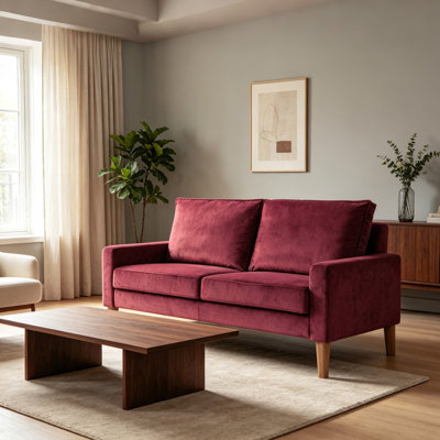 Canapé compact deux places en velours bourgogne, structure en bois massif, coussins à ressorts, style minimaliste moderne, idéal pour un salon ou un appartement.