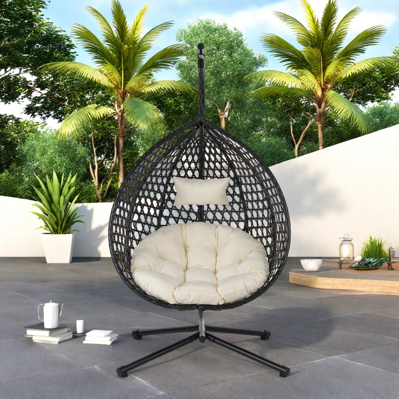 Fauteuil à œufs suspendu polyvalent avec motif en rotin évidé Pe, base en fer, appui-tête et coussin