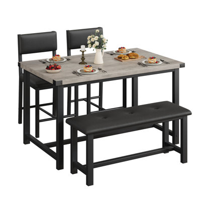 Ensemble de salle à manger moderne de 4 pièces pour 4 personnes, comprenant une table en composite de bois, une banquette rembourrée et 2 chaises. Installation facile, idéale pour les petites cuisines et salles à manger. Gris.