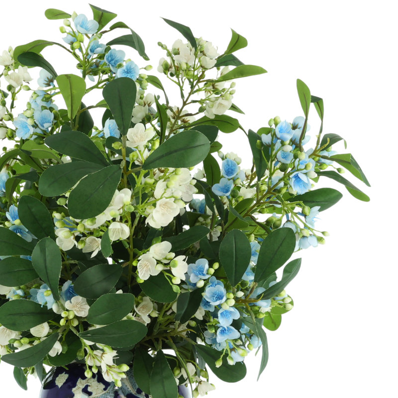 Tiges en herbe dans un vase décoratif, Bleu ; blanc