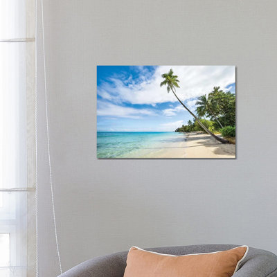 Palm Tree At The Beach On A Tropical Island In The South Sea by Jan Becke - Wrapped Canvas Print