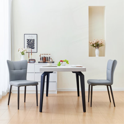 Ensemble de 2 chaises de salle à manger à haut dossier avec design ergonomique: structure en fer forgé, siège en cuir et coussins en éponge à rebond élevé