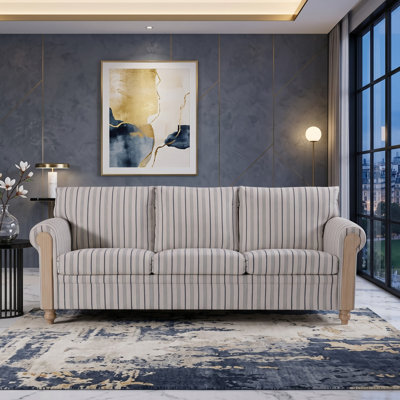Fauteuil rayé rembourré avec accoudoirs roulés en bois
