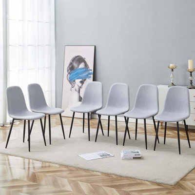 Ensemble de chaises de salle à manger rembourrées en tissu avec 4 pieds en métal et siège intégré