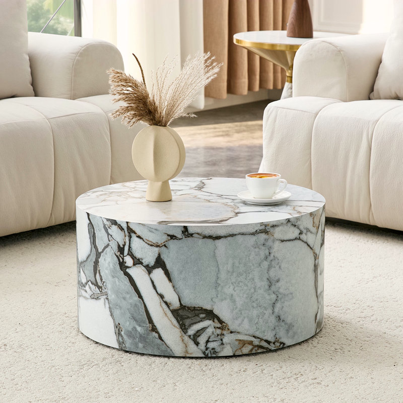 Table basse cylindrique simple texturée en marbre blanc