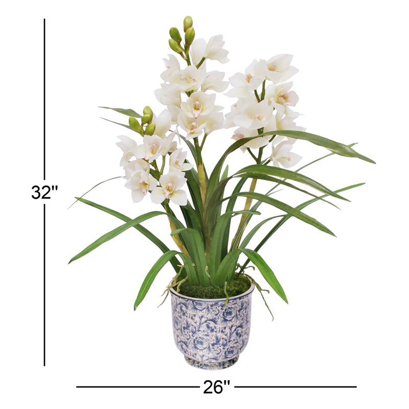 Arrangement floral cymbidium orchidées dans un pot de cache