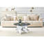 Table basse ronde artistique en forme de X. Verre trempé gris fumé + base en panneau de fibres à densité moyenne à motif de marbre bulgari blanc, table basse de salon luxueuse et légère.