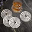 Antique Nickel Textured Round Aluminum Coaster Set with Felted Base and Stand (Set of 4)