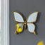 Miroir d'appoint en forme de papillon avec finition dorée