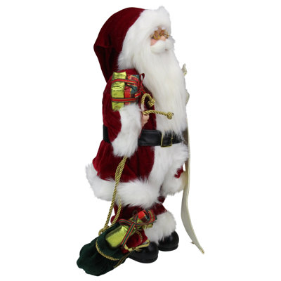 Père Noël traditionnel avec sac-cadeau et liste de Noël