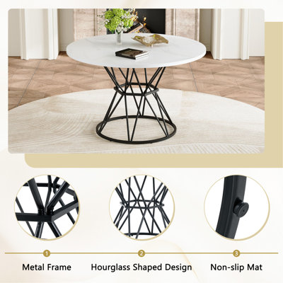 Ensemble de table et de chaises. Cette table de salle à manger circulaire en panneau de fibres à densité moyenne de 47,3 pouces de diamètre possède des supports en forme de sablier. Elle est dotée de 6 chaises en polyuréthane avec boucle décorative sur le dossier.