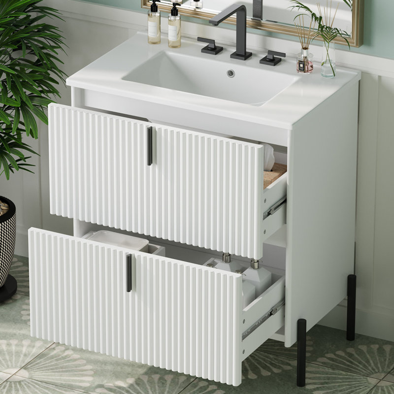Meuble-lavabo de salle de bain avec lavabo en céramique, tiroirs à deux niveaux et conception cannelée pour un rangement élégant et hygiénique