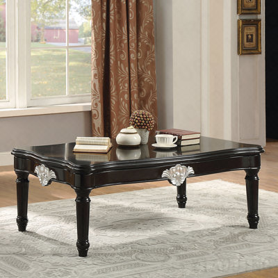 Table basse noire avec pieds tournés