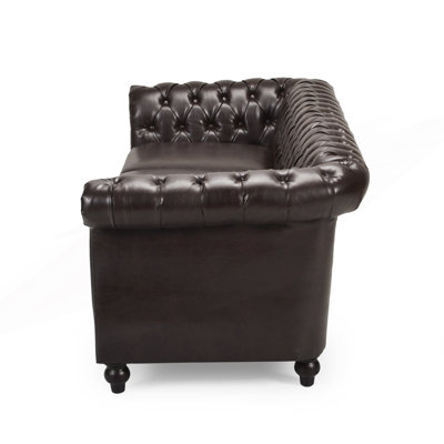 Luxueux canapé Chesterfield 3 places avec capitonnage profond et accoudoirs sculptés