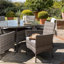 Dubose 4 - Person Wicker Patio Dining Set with Round Table , Cushions Included-969686495