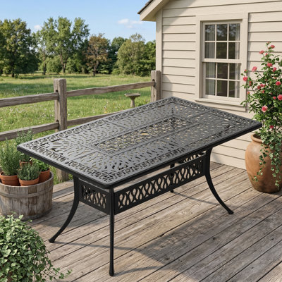 Outdoor dining table constructed of cast aluminum, dimensions 58.27 inches in length by 34.65 inches in width. Features a black frame and an umbrella hole.