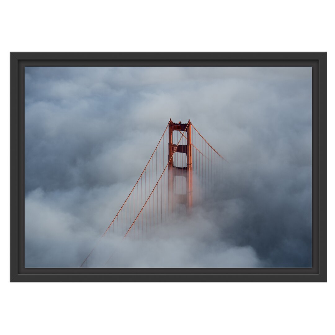 Gerahmtes Wandbild Golden Gate Bridge über den Wolken