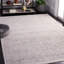 Tapis abstrait en polyester tissé à la machine en ivoire / gris / rouille-939363787