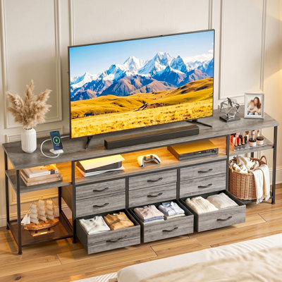 Meuble télé de 70 pouces avec éclairage DEL RVB, prises électriques, 9 tiroirs en tissu, centre multimédia de style industriel pour téléviseurs jusqu'à 70 pouces