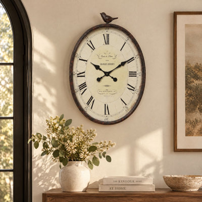 Horloge murale ovale en métal avec oiseau Scriber