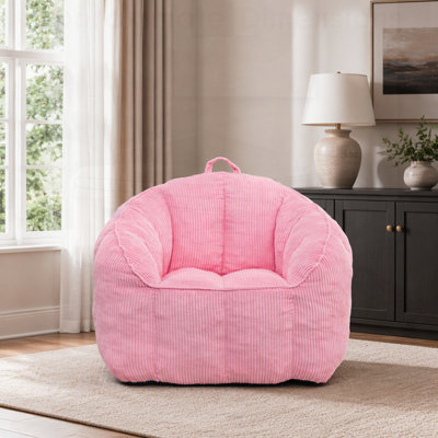 Pouf géant en velours côtelé, confortable et garni de coussins, idéal pour les adultes et les adolescents.