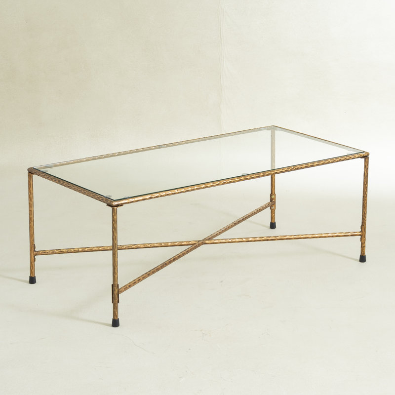 Table basse moderne en verre avec cadre en métal doré