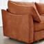 Avec une chenille orange, un accoudoir épuré et un tiroir de siège escamotable avec coussins intégrés, un espace de détente dissimulé et confortable