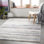 Tapis rayé bleu clair / blanc cassé / gris Banuelos