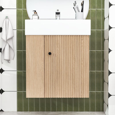 Meuble-lavabo moderne flottant avec porte à motif de vagues, lavabo en céramique et tablettes de rangement
