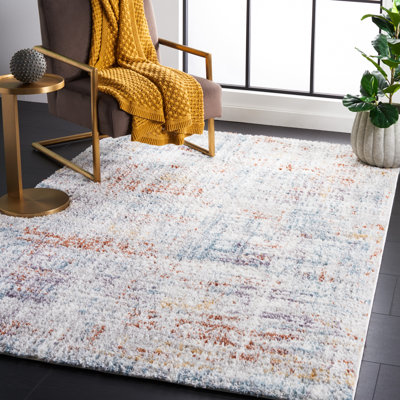 Tapis bleu rouille / ivoire Gregor Padula