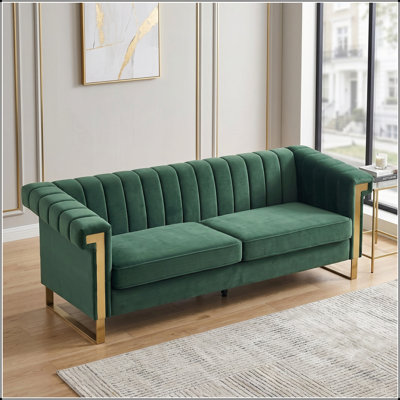 Modern Retro Green Velvet Sofa with Gold Accents, Channel-Tufted Upholstery for Stylish Living Rooms and Offices.